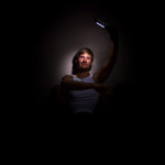 model, male, flashlight, LED, dark, person, man, middle aged, muscles, muscular, smile, smiling, shadow, nipple, male nipple